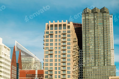 Preview: Skyline view showcasing modern architecture against a cloudy blue sky