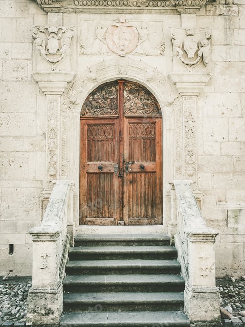 Preview: Vertical closeup shot of a Saint Michael Roman-Catholic Cathedral entrance door in Romania