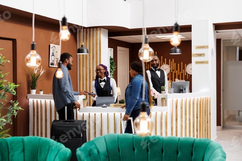 Preview: Black couple checking in into hotel