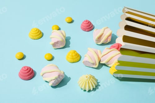Preview: Jelly candies and marshmallows, popcorn bag on blue background
