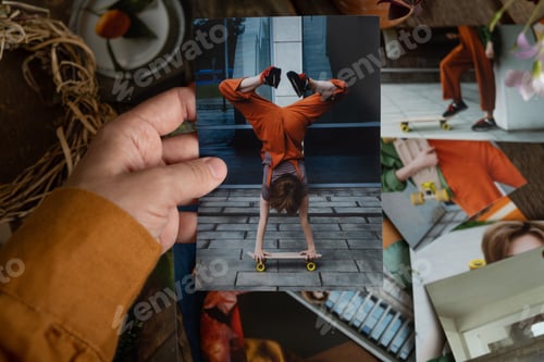 Preview: Female hand hold printed photo. Photo printing concept.