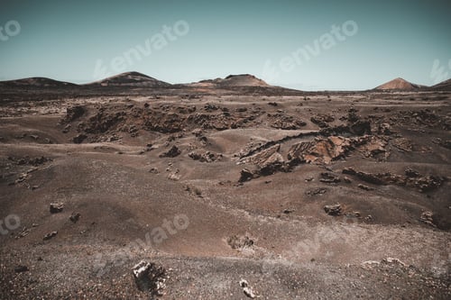 Preview: Valley with roads between mountains near sea and cloudy sky
