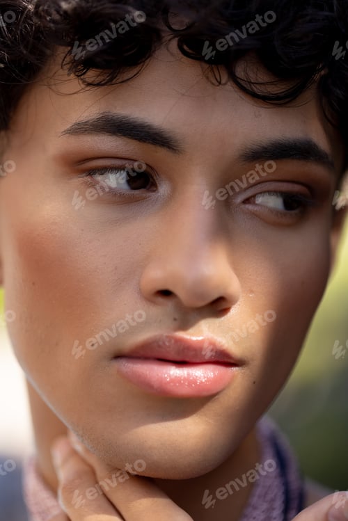 Preview: Close-up of transgender transgender woman with thoughtful expression, showcasing natural beauty