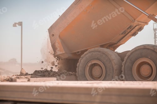 Preview: Dump truck unloading gravel at a construction site