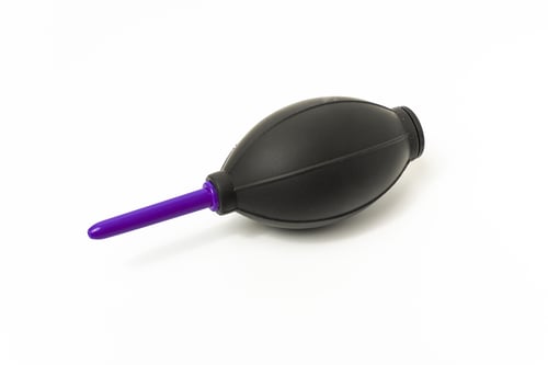 Preview: the large plastic object is made of black rubber with a purple handle