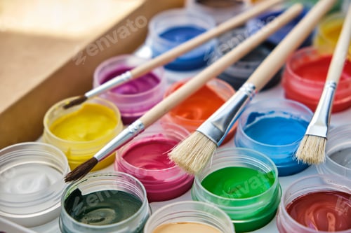 Preview: Closeup of acrylic paints, palette of paints and paint brushes. New set of 24 paint colors for paint