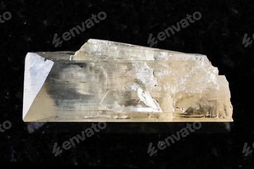 Preview: sample of raw danburite mineral on black granite
