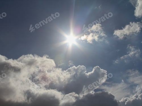 Preview: Cloudscape with a Radiant Sunburst on a Blue Sky