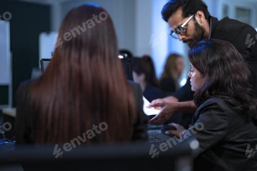 Preview: IT specialist guides a software developer through the company's