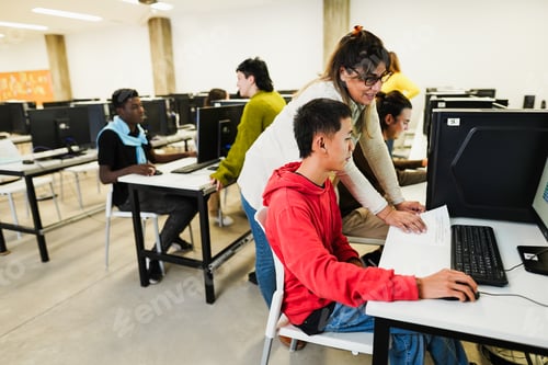 Preview: Students using computers softwares at college IT class - Woman teacher working at university