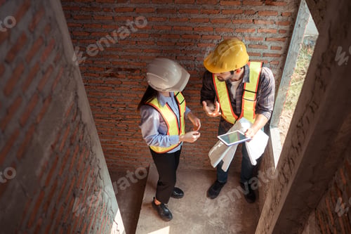 Preview: Architects and engineers work together to assess the residential home construction site's progress