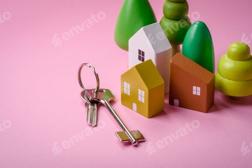 Preview: A small wooden house and keys as an idea for investing in your own home