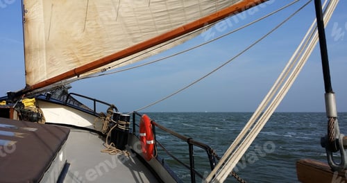 Preview: Closeup shot of a dutch flatboat sailing in the open sea at daytime