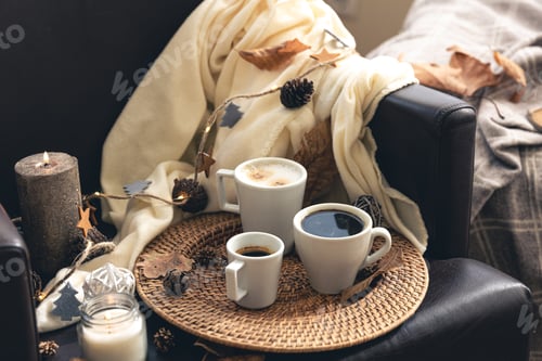 Preview: Autumn composition with cups of coffee and leaves.