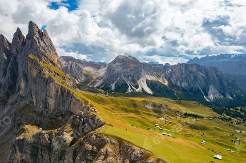 Preview: The steep slope of the rocky Seceda mountain covered with lush green grass.