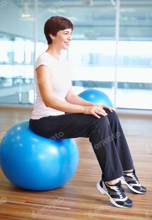 Preview: Woman sitting on gymnastic ball