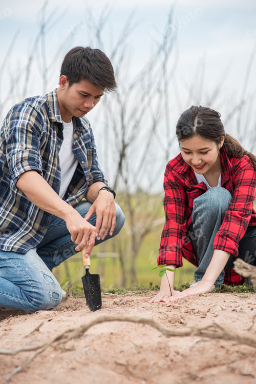 Preview: Men and women help grow trees.
