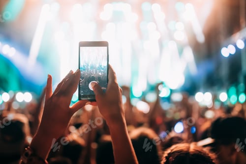 Preview: Portrait of happy crowd enjoying at music festival