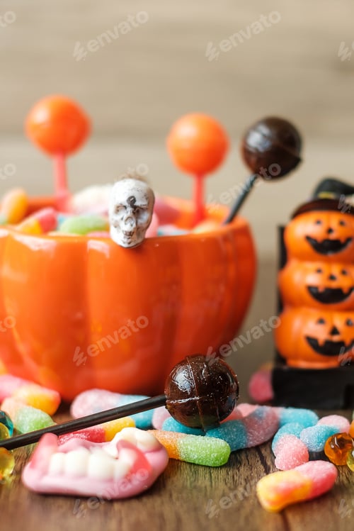 Preview: Happy Halloween day with ghost candies, pumpkin, bowl and decorative. Trick or Threat