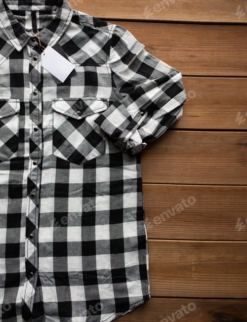 Preview: close up of checkered shirt on wooden background