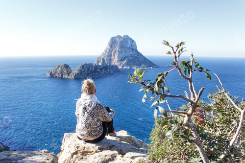 Preview: Woman sitting and admiring the view