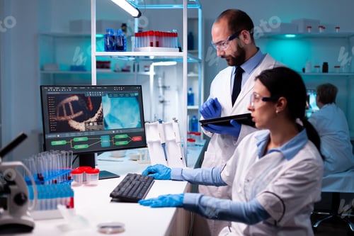 Preview: Team of researcher working in science laboratory