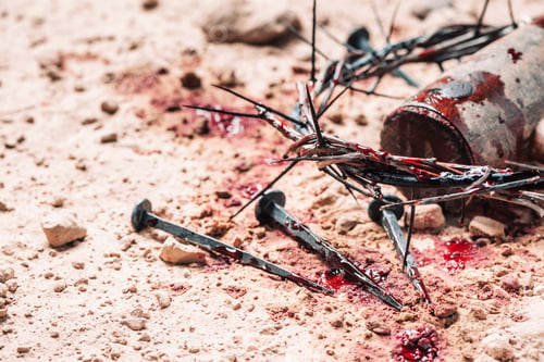 Preview: Bloody nails, crown of thorns with drops of blood over grunged background. Good Friday, Passion of