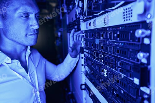 Preview: Engineer performing visual inspection of server hardware
