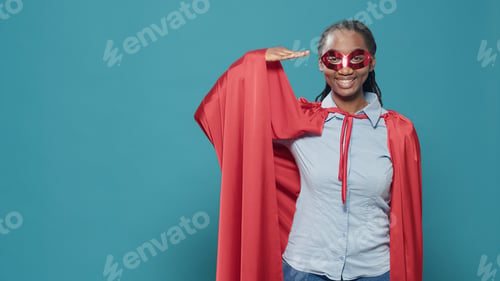 Preview: Portrait of superhero with cape and red mask