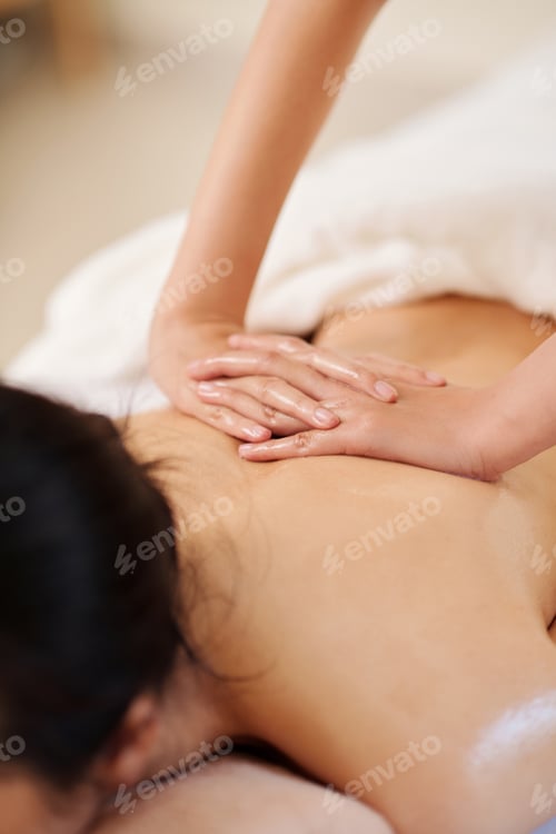 Preview: Masseuse Massaging Back of Client