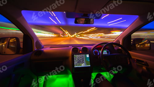 Preview: The man drive in a road with a navigation. Evening night time. Left side traffic