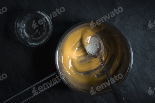 Preview: Molten butter in a sautepan on a gray stone