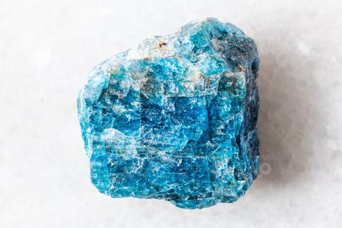 Preview: sample of rough blue apatite rock on white