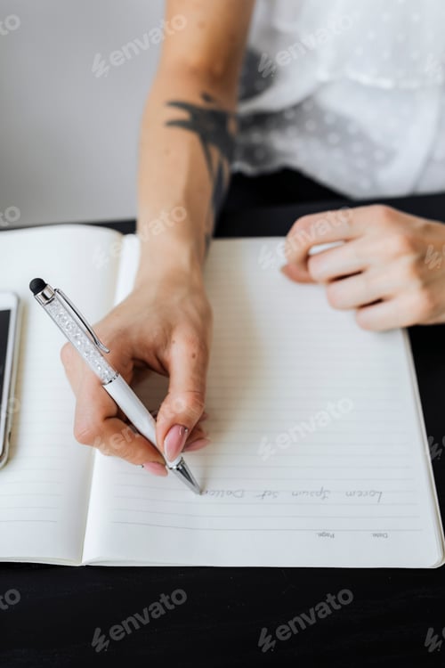 Preview: Woman taking notes