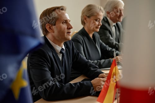 Preview: Middle Aged Caucasian Businesspeople Attending International Conference Meeting