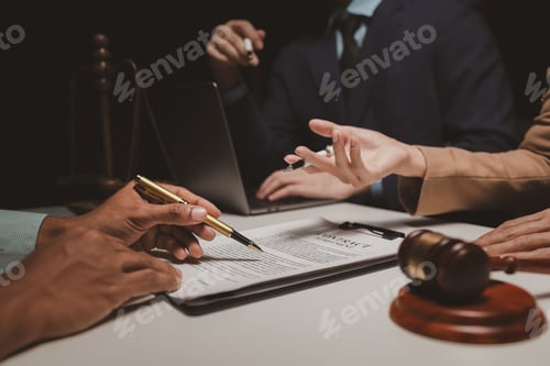Preview: A group of lawyers is discussing contract documents that must be presented to a client, Lawyers brai