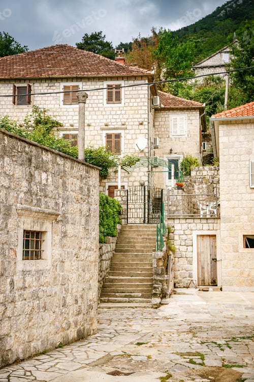 Preview: Small street with old residential stone houses in Perast