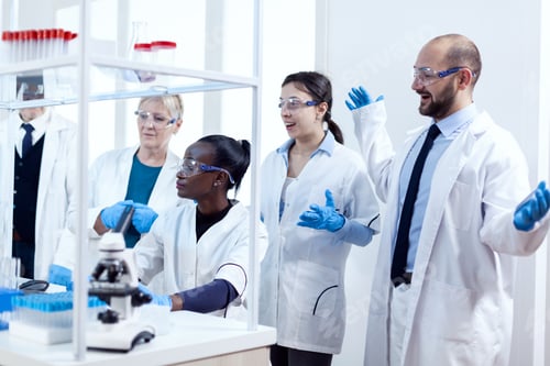 Preview: Group of scientists with diverse race working to find a cure vor virus