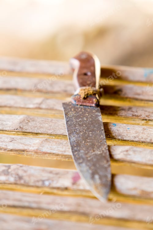 Preview: Old table knife on wooden background, Brazil