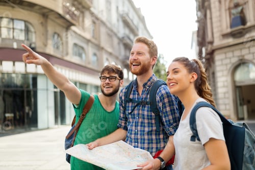 Preview: Young happy tourists sightseeing in city