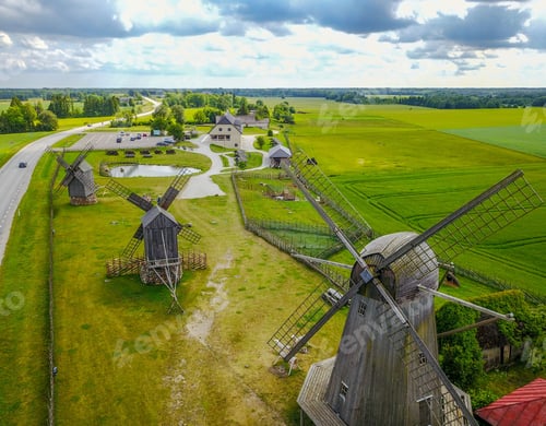 Preview: Aerial view of wooden windmills situated in a rural landscape in Estonia.