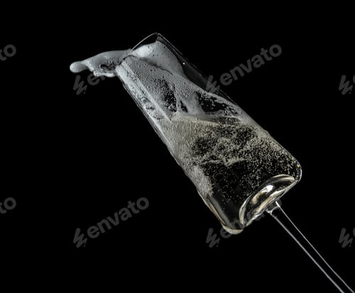 Preview: Glass of champagne on black background. Festive drink