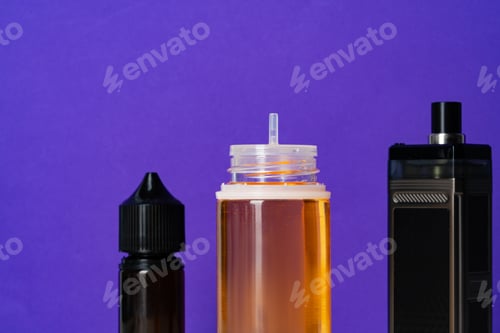 Preview: Electronic cigarettes liquid bottles on purple background