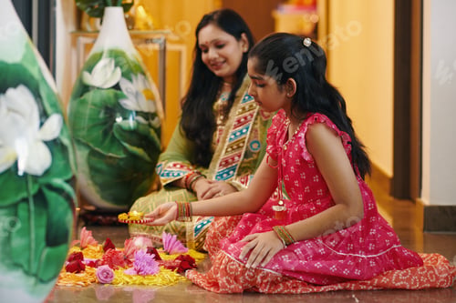 Preview: Girl Making Flower Composition With Candles