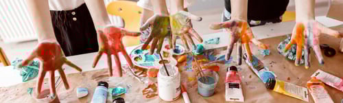 Preview: Children demonstrating their palms painted with watercolor