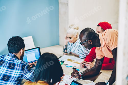 Preview: High angle of adult diverse coworkers