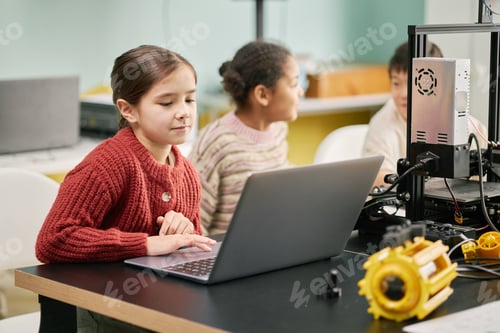 Preview: Portrait of Girls Engaging in STEM Activities with Laptops