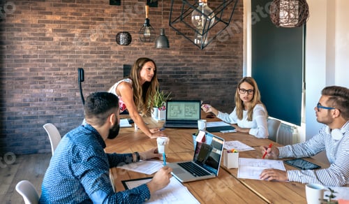 Preview: Female boss supervising work meeting