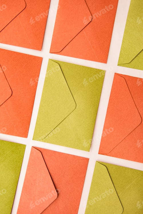 Preview: Layout of multicolour envelopes on desk. Envelope pattern background