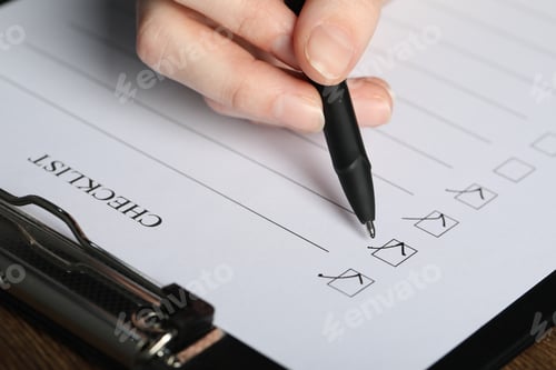 Preview: Woman filling Checklist with pen at table, closeup